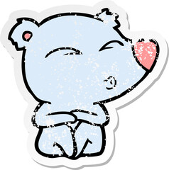 distressed sticker of a cartoon whistling bear