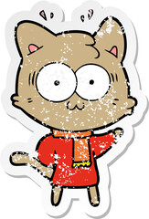 distressed sticker of a cartoon surprised cat wearing warm winter clothes
