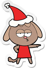 hand drawn sticker cartoon of a bored dog wearing santa hat