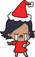 hand drawn line drawing of a girl crying and pointing wearing santa hat