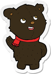 sticker of a cartoon cute black bear cub