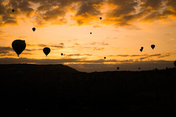 Flying balloon photo taken with sunrise in CAPPADOCIA