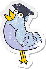 retro distressed sticker of a cartoon bird wearing graduation cap