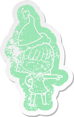 quirky cartoon distressed sticker of a woman wearing santa hat