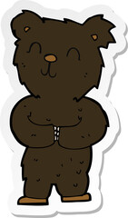 sticker of a cartoon happy little black bear