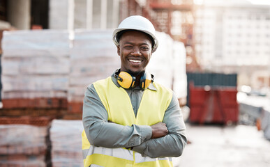 Black man, portrait smile and arms crossed for construction, project management or architecture in city. Happy African male person, engineer or architect smiling in confidence for industrial building