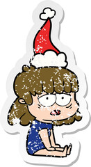hand drawn distressed sticker cartoon of a tired woman wearing santa hat