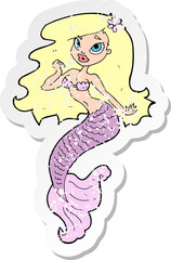 retro distressed sticker of a cartoon pretty mermaid