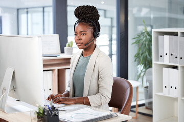 Call center, computer and black woman typing for telemarketing, customer service or support. Contact us, crm or African female sales agent, consultant or person focus on business in help desk office.