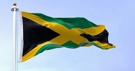 Jamaica national flag waving in the wind on a clear day