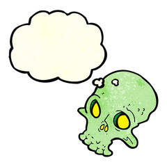 cartoon spooky skull with thought bubble