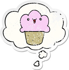 cartoon cupcake with face with thought bubble as a distressed worn sticker