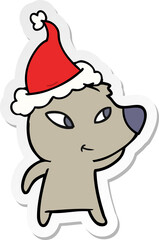 cute hand drawn sticker cartoon of a bear wearing santa hat