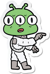 sticker of a cartoon three eyed alien