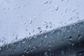 Raindrops on the window. Cloudy day evoke melancholy and sadness. Bad mood.