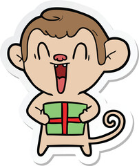 sticker of a cartoon laughing monkey