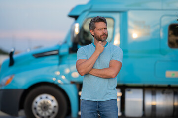 Men driver near lorry truck. Man owner truck driver near truck. Handsome middle aged man trucker...
