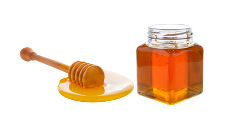 Wooden honey dipper with honey on transparent png