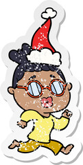 hand drawn distressed sticker cartoon of a woman wearing spectacles wearing santa hat
