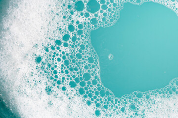 Detergent foam bubble on wate. Blue background, Soap sud