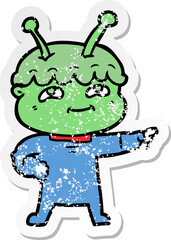 distressed sticker of a friendly cartoon spaceman