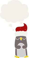 cartoon christmas penguin with thought bubble in retro style