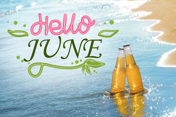 Hello June. Bottles of cool beer in sea water on sunny day