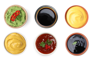 Set of guacamole and different sauces on white background, top view