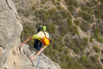 Obraz premium Climbing a stone wall in Spain