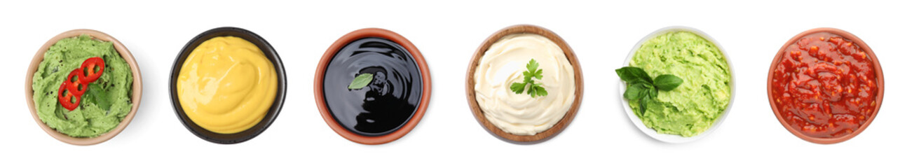 Set of guacamole and different sauces on white background, top view