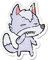 distressed sticker of a unsure wolf showing teeth
