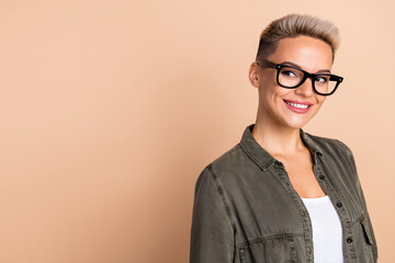 Photo of nice cheerful lawyer girl toothy smile look interested empty space isolated on beige color background