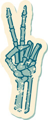 iconic distressed sticker tattoo style image of a skeleton giving a peace sign