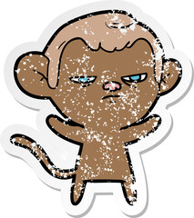 distressed sticker of a cartoon annoyed monkey