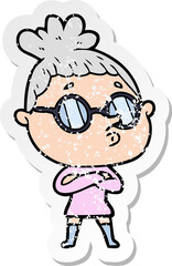 distressed sticker of a cartoon woman wearing glasses