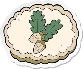 sticker of a cartoon acorn symbol