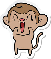 sticker of a cartoon laughing monkey