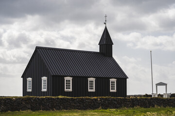 Fototapeta na wymiar The black church of budir on the peninsula snaefellsnes in iceland in summer