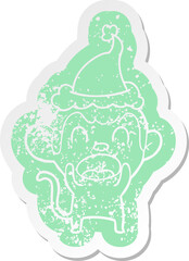 shouting quirky cartoon distressed sticker of a monkey wearing santa hat