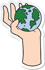 sticker of a cartoon hand holding whole earth