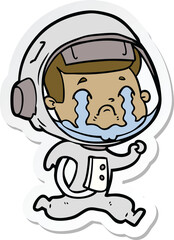 sticker of a cartoon crying astronaut