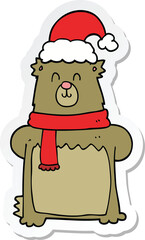 sticker of a cartoon bear wearing christmas hat