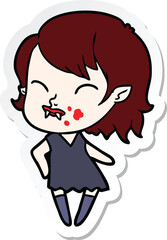 sticker of a cartoon vampire girl with blood on cheek