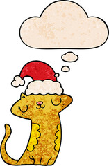 cute cartoon cat wearing christmas hat with thought bubble in grunge texture style