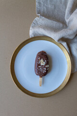 Chocolate cake pop on a warm neutral background