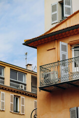 Yellow and orange facades of houses in the center of Antibes, on the French Riviera