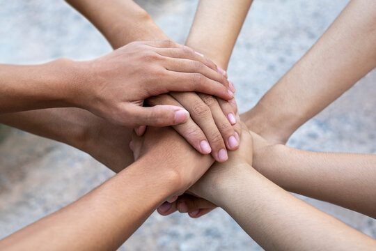 Close-Up, people join hands together. Unity and teamwork concept.