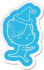 quirky cartoon  sticker of a girl in onesie wearing santa hat