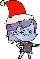 annoyed hand drawn textured cartoon of a vampire girl wearing santa hat