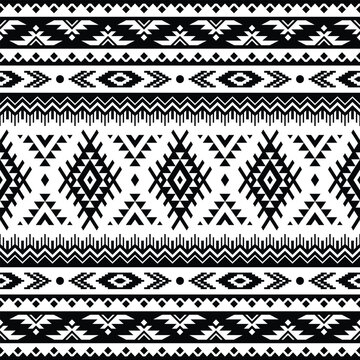 Geometric abstract shapes of tribal. Seamless ethnic pattern. Textile print traditional design in Aztec and Navajo style. Black and white colors. Design for textile, fabric, curtain, rug, ornament.